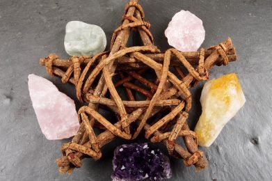 Woven wooden petagram or star with crystals.